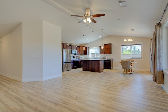 3503 Americana Way, Redding, CA 96003 - kitchen with light wood-style floors, lofted ceiling, visible vents, and appliances with stainless steel finishes