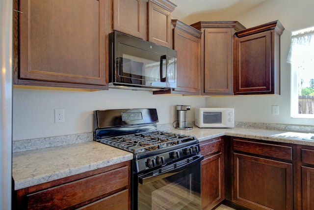 3503 Americana Way, Redding, CA 96003 - kitchen featuring black appliances and light stone counters