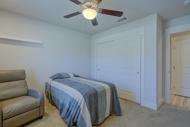 3503 Americana Way, Redding, CA 96003 - bedroom featuring light carpet, baseboards, visible vents, a closet, and ceiling fan