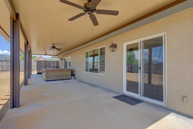 3503 Americana Way, Redding, CA 96003 - view of patio / terrace with fence, a ceiling fan, and a hot tub
