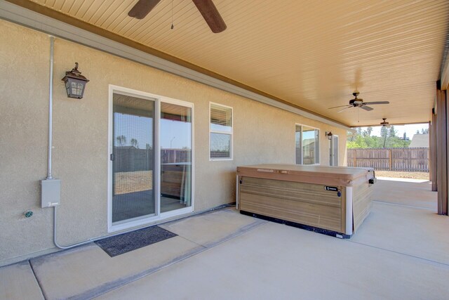 3503 Americana Way, Redding, CA 96003 - view of patio / terrace featuring fence, ceiling fan, and a hot tub