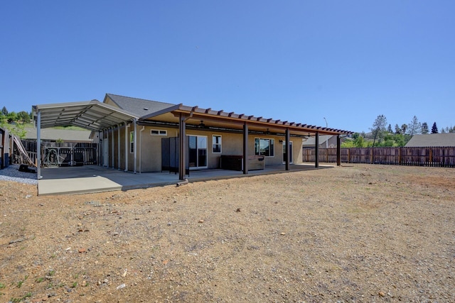 3503 Americana Way, Redding, CA 96003 - rear view of house featuring stucco siding, a fenced backyard, and a patio