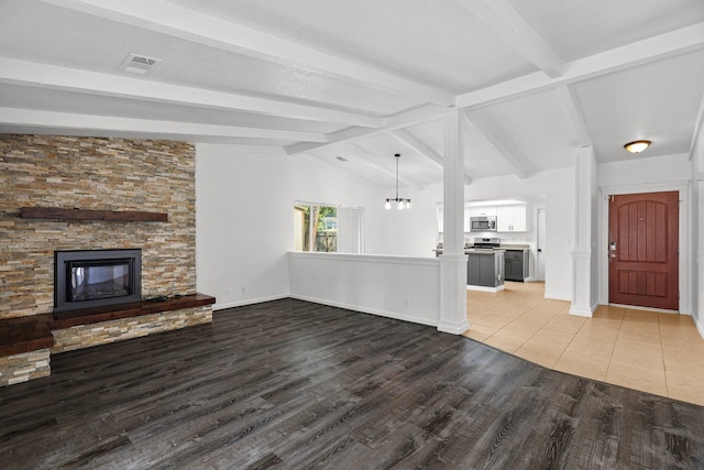 2633 Forest Ct, Redding, CA 96002 - unfurnished living room featuring a stone fireplace and light wood-type flooring