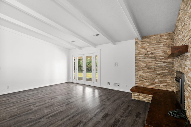2633 Forest Ct, Redding, CA 96002 - unfurnished living room with beam ceiling, dark wood-type flooring, a fireplace, and french doors