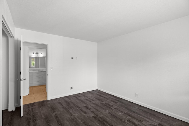 2633 Forest Ct, Redding, CA 96002 - unfurnished bedroom with dark wood finished floors and a closet