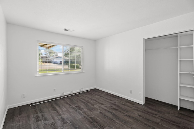 2633 Forest Ct, Redding, CA 96002 - unfurnished bedroom featuring dark wood-style flooring and a closet