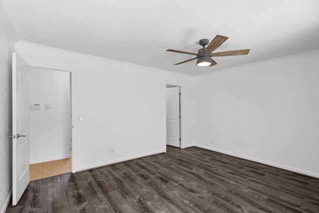 2633 Forest Ct, Redding, CA 96002 - spare room featuring dark wood-style floors, ceiling fan, ornamental molding, and a textured ceiling