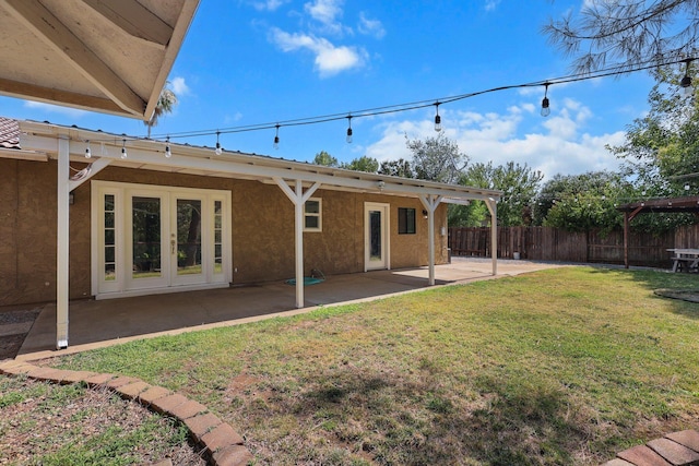2633 Forest Ct, Redding, CA 96002 - rear view of property featuring stucco siding, a patio area, and french doors