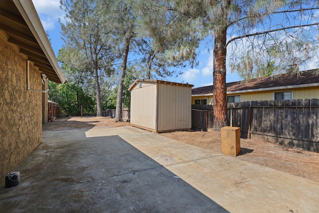 2633 Forest Ct, Redding, CA 96002 - fenced backyard featuring a storage shed and a patio