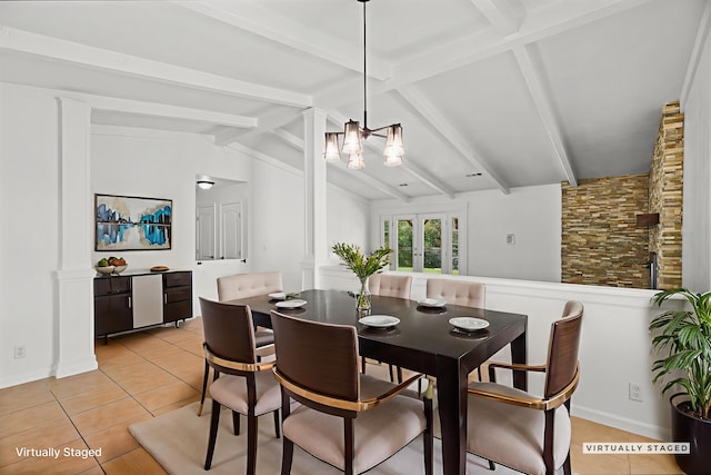2633 Forest Ct, Redding, CA 96002 - dining room featuring light tile patterned flooring, a chandelier, and decorative columns