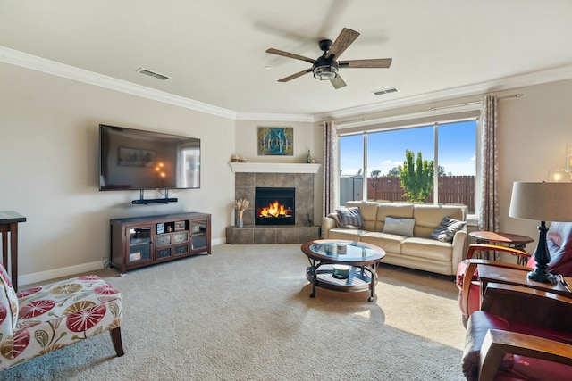 5538 Muir Peak Rd, Redding, CA 96002 - carpeted living room with crown molding, a tile fireplace, visible vents, and a ceiling fan