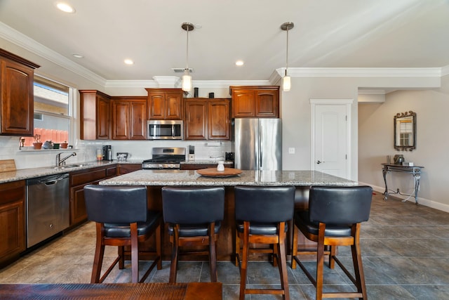 5538 Muir Peak Rd, Redding, CA 96002 - kitchen with ornamental molding, a center island, a kitchen breakfast bar, and stainless steel appliances