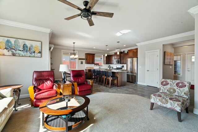5538 Muir Peak Rd, Redding, CA 96002 - living room featuring recessed lighting, dark colored carpet, baseboards, ornamental molding, and ceiling fan with notable chandelier