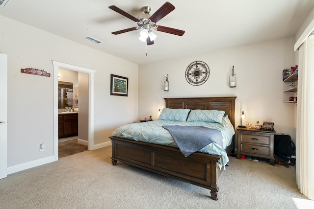 5538 Muir Peak Rd, Redding, CA 96002 - bedroom featuring connected bathroom, light colored carpet, ceiling fan, visible vents, and baseboards