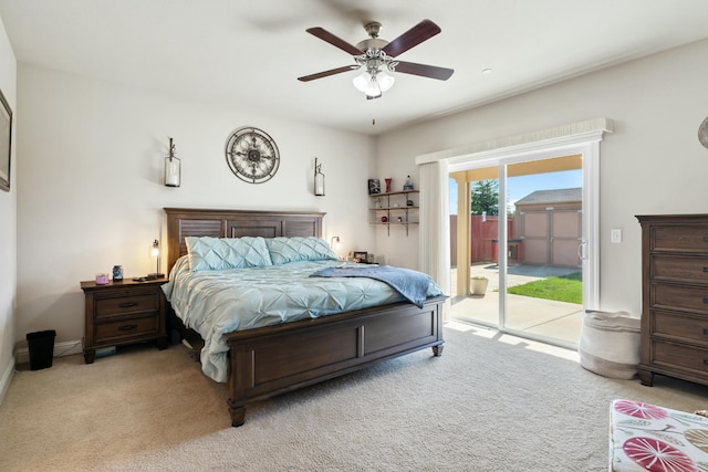 5538 Muir Peak Rd, Redding, CA 96002 - bedroom with access to exterior, ceiling fan, light carpet, and baseboards