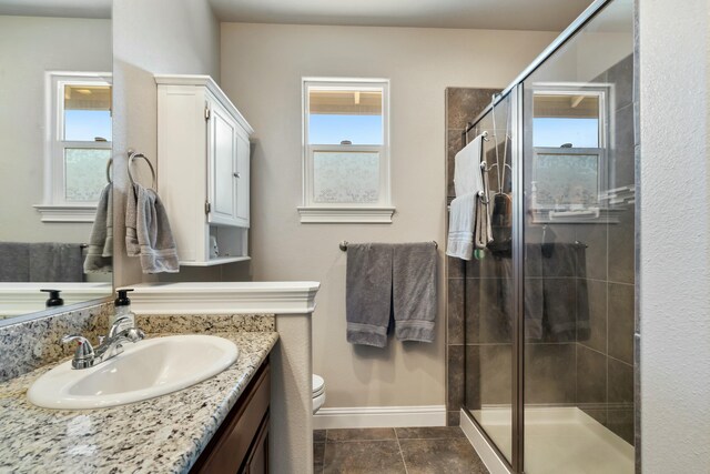 5538 Muir Peak Rd, Redding, CA 96002 - full bath with baseboards, a shower stall, vanity, and plenty of natural light
