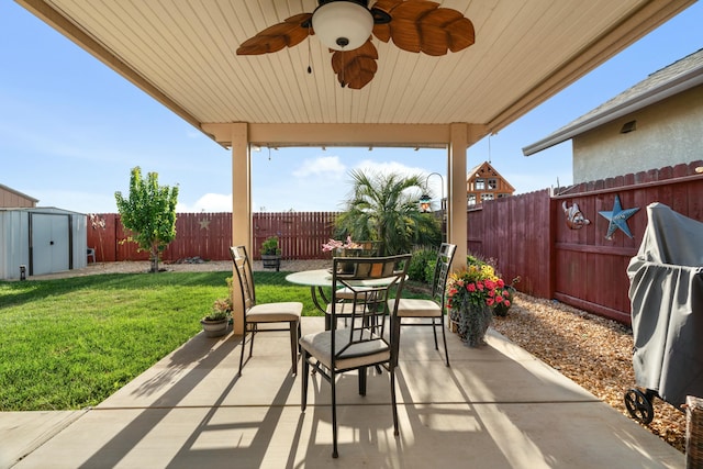 5538 Muir Peak Rd, Redding, CA 96002 - view of patio / terrace with an outdoor structure, a ceiling fan, a shed, and a fenced backyard
