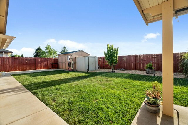 5538 Muir Peak Rd, Redding, CA 96002 - view of yard with an outdoor structure, a storage shed, and a fenced backyard