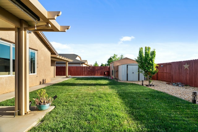 5538 Muir Peak Rd, Redding, CA 96002 - view of yard with an outdoor structure, a storage shed, and a fenced backyard