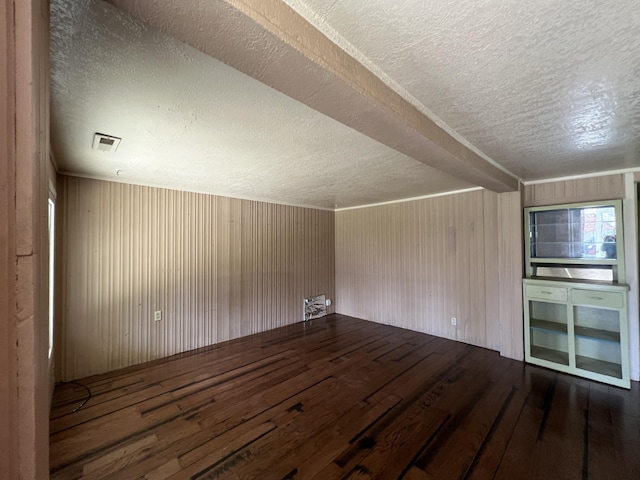 36770 Woods Ave, Burney, CA 96013 - empty room featuring a textured ceiling, hardwood / wood-style floors, and wood walls