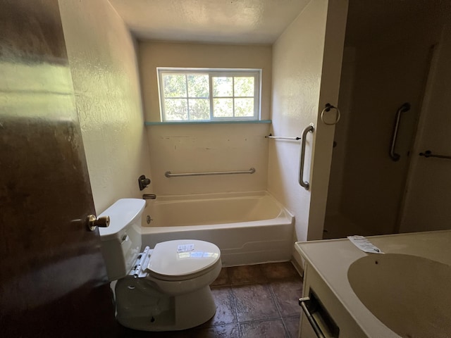 36770 Woods Ave, Burney, CA 96013 - full bath featuring toilet, a textured wall, a tub to relax in, vanity, and a shower