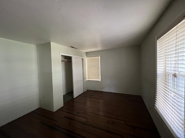 36770 Woods Ave, Burney, CA 96013 - unfurnished bedroom featuring wood finished floors and a closet