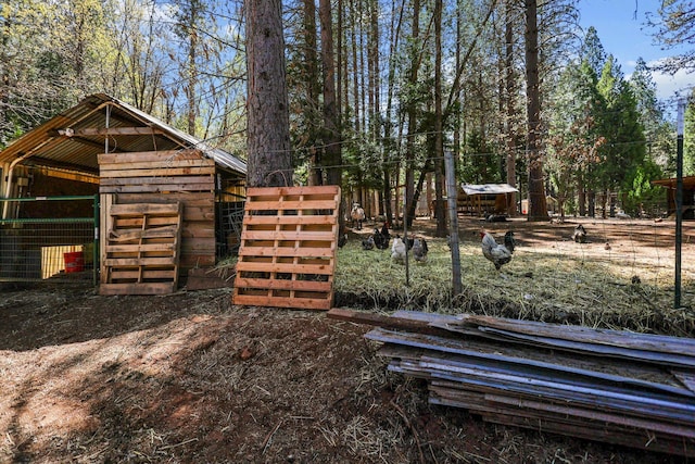view of yard with an outbuilding and an exterior structure