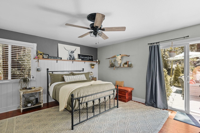 bedroom with access to exterior, ceiling fan, and wood finished floors