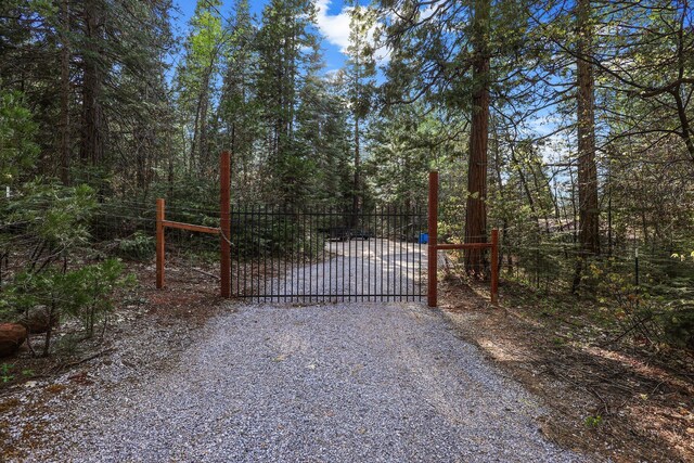 view of gate with fence