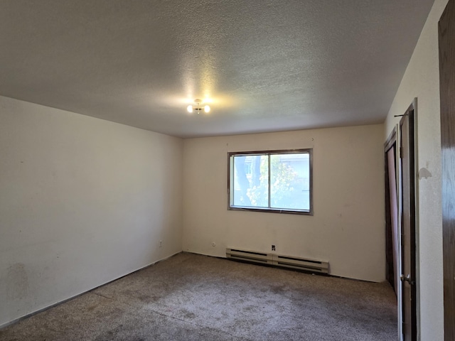 unfurnished bedroom featuring a baseboard heating unit, carpet floors, and a textured ceiling