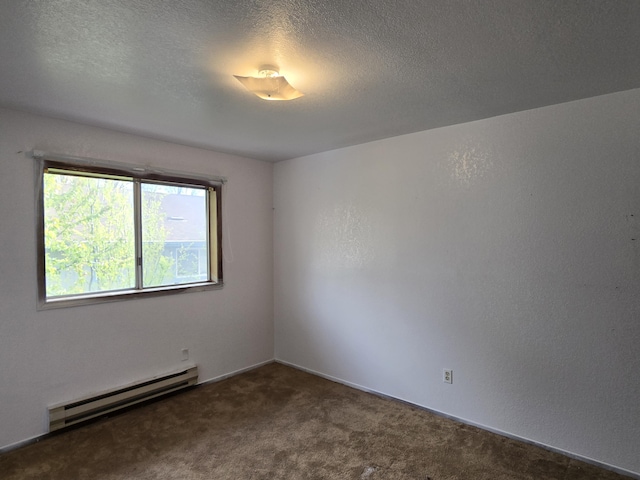 unfurnished room featuring baseboard heating, carpet floors, and a textured ceiling