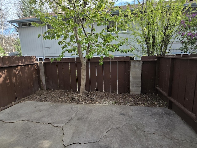 view of patio featuring fence