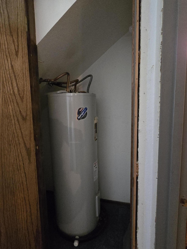 utility room with electric water heater