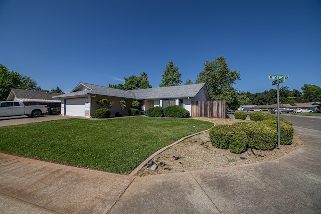 1695 Canter Ct, Redding, CA 96002 - ranch-style home with a front yard, driveway, an attached garage, and fence