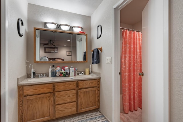 1695 Canter Ct, Redding, CA 96002 - full bathroom with ceiling fan, a shower with curtain, double vanity, and a sink