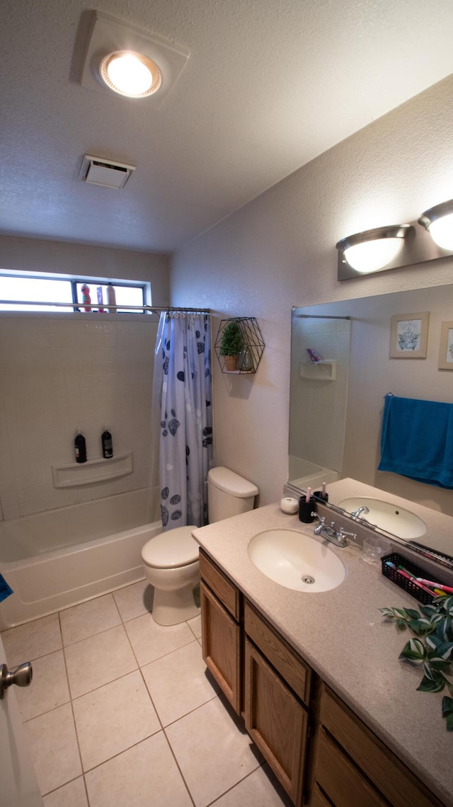 1695 Canter Ct, Redding, CA 96002 - bathroom featuring vanity, shower / bath combo with shower curtain, toilet, visible vents, and tile patterned flooring