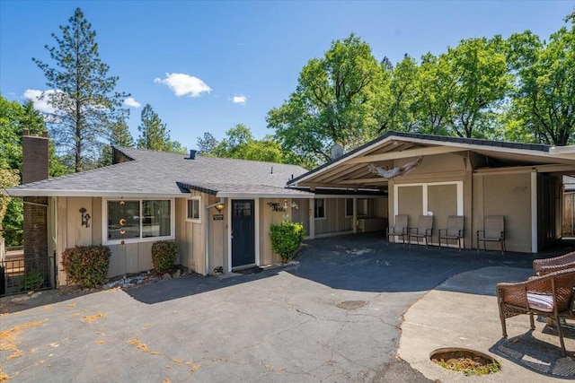 19817 Oak Knoll Dr, Lakehead, CA 96051 - view of front facade with roof with shingles, a chimney, and aphalt driveway