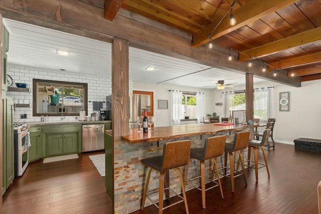 19817 Oak Knoll Dr, Lakehead, CA 96051 - bar featuring beam ceiling, stainless steel dishwasher, dark wood-style floors, and double oven range