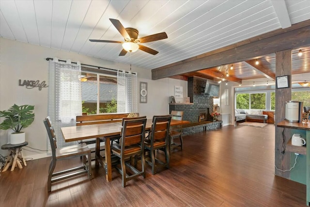 19817 Oak Knoll Dr, Lakehead, CA 96051 - dining area with beam ceiling, a brick fireplace, a ceiling fan, wood ceiling, and wood finished floors