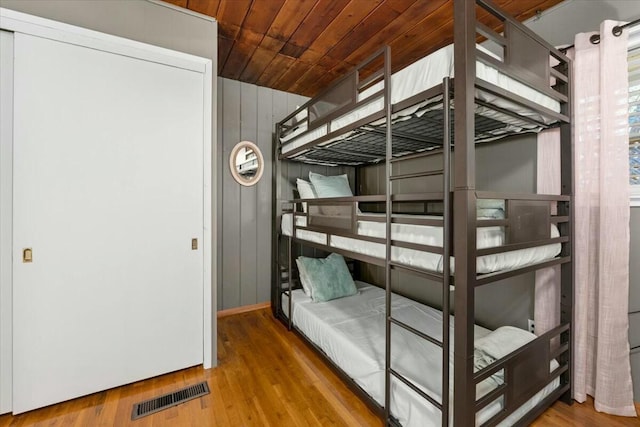 19817 Oak Knoll Dr, Lakehead, CA 96051 - unfurnished bedroom featuring visible vents, wood finished floors, and wooden ceiling