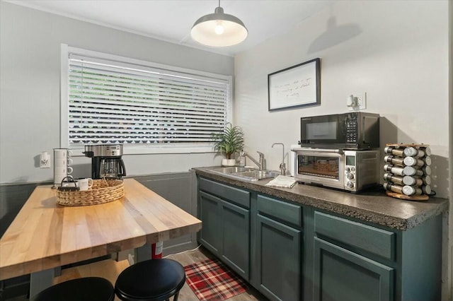 19817 Oak Knoll Dr, Lakehead, CA 96051 - kitchen featuring black microwave, dark countertops, plenty of natural light, and a sink