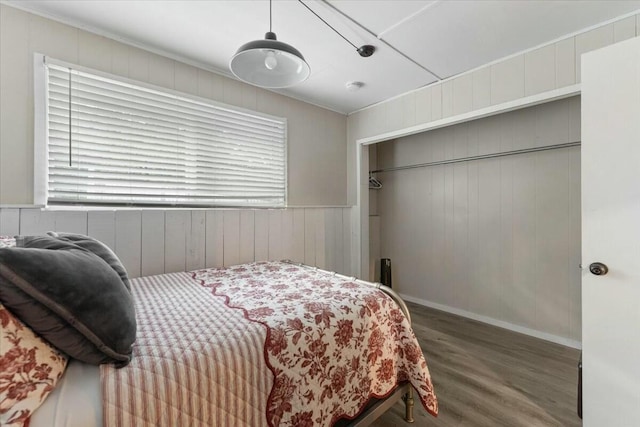 19817 Oak Knoll Dr, Lakehead, CA 96051 - bedroom featuring wood walls, wood finished floors, and multiple windows