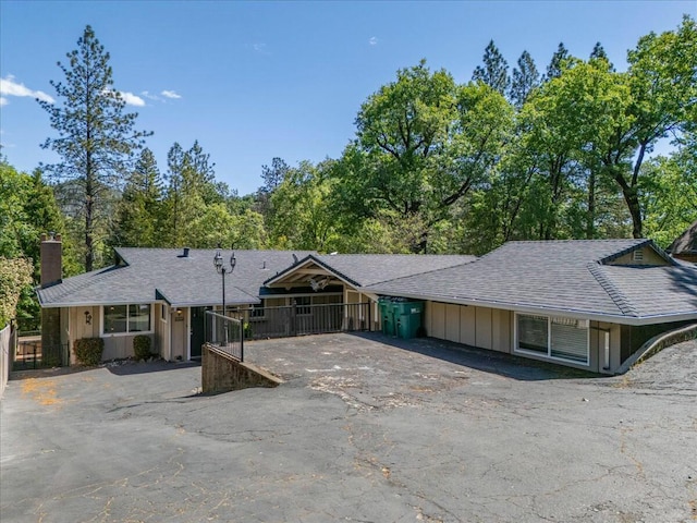 19817 Oak Knoll Dr, Lakehead, CA 96051 - ranch-style home featuring a chimney, fence, driveway, and roof with shingles