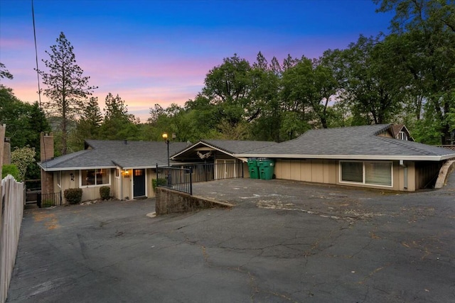19817 Oak Knoll Dr, Lakehead, CA 96051 - view of front facade with driveway, fence, and a chimney
