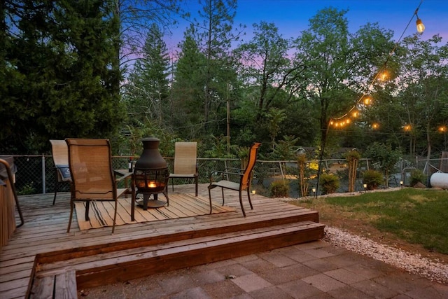 19817 Oak Knoll Dr, Lakehead, CA 96051 - deck at dusk featuring a fire pit and fence