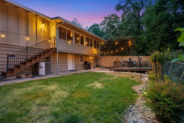 19817 Oak Knoll Dr, Lakehead, CA 96051 - rear view of house featuring a deck, a yard, stairway, fence, and cooling unit