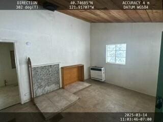 interior space featuring wooden ceiling, a wall unit AC, and unfinished concrete flooring