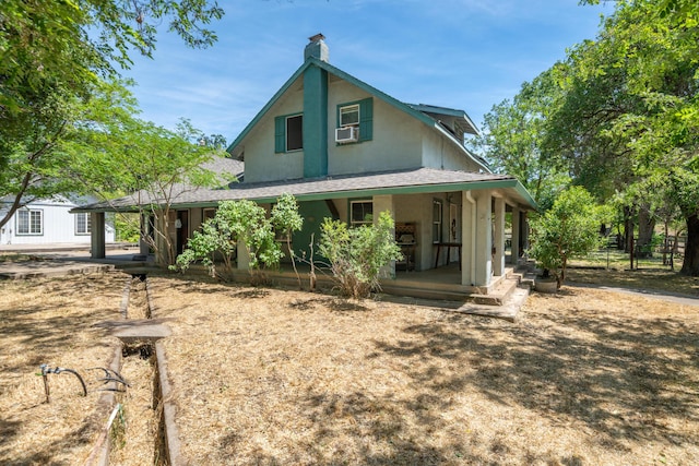 24294 Dersch Rd, Anderson, CA 96007 - view of front of house with a porch, a chimney, and stucco siding