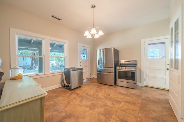 24294 Dersch Rd, Anderson, CA 96007 - kitchen with stainless steel appliances, a chandelier, baseboards, and pendant lighting
