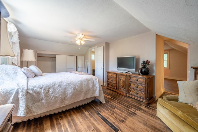 24294 Dersch Rd, Anderson, CA 96007 - bedroom featuring vaulted ceiling, dark wood-type flooring, a textured ceiling, baseboards, and a ceiling fan